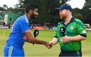 18 August 2023; Team captains Paul Stirling of Ireland, right, and Jasprit Bumrah of India shake hands before match one of the Men's T20 International series between Ireland and India at Malahide Cricket Ground in Dublin. Photo by Seb Daly/Sportsfile