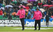 18 August 2023; Umpires Roland Black, left, and Mark Hawthorne order the players off the field due to rain during match one of the Men's T20 International series between Ireland and India at Malahide Cricket Ground in Dublin. Photo by Seb Daly/Sportsfile