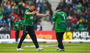 18 August 2023; Paul Stirling of Ireland, right, is congratulated by teammate Craig Young after claiming the wicket of India's Yashasvi Jaiswal during match one of the Men's T20 International series between Ireland and India at Malahide Cricket Ground in Dublin. Photo by Seb Daly/Sportsfile