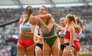 19 August 2023; Kate O’Connor of Ireland, right, and Xénia Krizsan of Hungary after their heat of the 100m hurdles of the Women's Heptathlon during day one of the World Athletics Championships at the National Athletics Centre in Budapest, Hungary. Photo by Sam Barnes/Sportsfile
