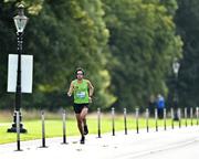 19 August 2023; Mick Clohisey of Raheny Shamrock AC, Dublin, on his way to finishing second, during the Irish Life Race Series– Frank Duffy 10 Mile at Phoenix Park in Dublin. Photo by Piaras Ó Mídheach/Sportsfile