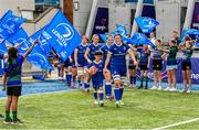 19 August 2023; Leinster captain Hannah O'Connor leads her side out with mascot Sean O'Byrne before the Vodafone Women’s Interprovincial Championship match between Leinster and Ulster at Energia Park in Dublin. Photo by Ben McShane/Sportsfile