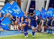 19 August 2023; Leinster captain Hannah O'Connor leads her side out with mascot Sean O'Byrne before the Vodafone Women’s Interprovincial Championship match between Leinster and Ulster at Energia Park in Dublin. Photo by Ben McShane/Sportsfile