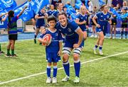 19 August 2023; Leinster captain Hannah O'Connor with mascot Sean O'Byrne before the Vodafone Women’s Interprovincial Championship match between Leinster and Ulster at Energia Park in Dublin. Photo by Ben McShane/Sportsfile