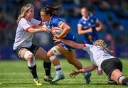 19 August 2023; Natasja Behan of Leinster is tackled by Peita McAllister, left, and Taryn Schutzler of Ulster during the Vodafone Women’s Interprovincial Championship match between Leinster and Ulster at Energia Park in Dublin. Photo by Ben McShane/Sportsfile