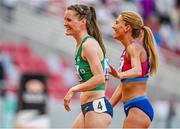 19 August 2023; Ciara Mageean of Ireland, left, and Cory Ann Mcgee of USA after competing in the women's 1500m during day one of the World Athletics Championships at the National Athletics Centre in Budapest, Hungary. Photo by Sam Barnes/Sportsfile