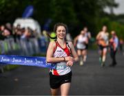 19 August 2023; Caitlyn Harvey of Roadrunners AC in Antrim, crosses the line to win the women's event, during the Irish Life Race Series– Frank Duffy 10 Mile at Phoenix Park in Dublin. Photo by Piaras Ó Mídheach/Sportsfile