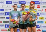 19 August 2023; Winner of the women's event Caitlyn Harvey of Roadrunners AC in Antrim, centre, with second-placed Maria Ní Mhaologain, left, and third-placed Yuliya Tarasova of Clonliffe Harriers AC after the Irish Life Race Series– Frank Duffy 10 Mile at Phoenix Park in Dublin. Photo by Piaras Ó Mídheach/Sportsfile