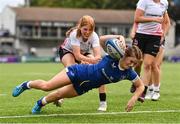 19 August 2023; Emma Brogan of Leinster is tackled by Erin McConalogue of Ulster on her way to scoring her side's fifth try during the Girl’s Interprovincial Championship match between Leinster and Ulster at Energia Park in Dublin. Photo by Ben McShane/Sportsfile