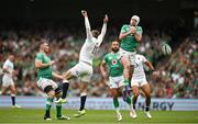 19 August 2023; Mack Hansen of Ireland and Elliot Daly of England contest a high ball during the Bank of Ireland Nations Series match between Ireland and England at Aviva Stadium in Dublin. Photo by Brendan Moran/Sportsfile
