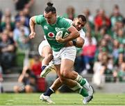 19 August 2023; James Lowe of Ireland is tackled by Joe Marchant of England during the Bank of Ireland Nations Series match between Ireland and England at the Aviva Stadium in Dublin. Photo by Harry Murphy/Sportsfile