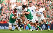 19 August 2023; Manu Tuilagi of England is tackled by Josh van der Flier and Ross Byrne of Ireland during the Bank of Ireland Nations Series match between Ireland and England at Aviva Stadium in Dublin. Photo by Brendan Moran/Sportsfile