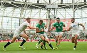 19 August 2023; Garry Ringrose of Ireland beats the tackle by Freddie Steward, left, and Elliot Daly of England on his way to scoring his side's second try during the Bank of Ireland Nations Series match between Ireland and England at Aviva Stadium in Dublin. Photo by Ramsey Cardy/Sportsfile