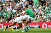 19 August 2023; James Lowe of Ireland is tackled by Manu Tuilagi of England during the Bank of Ireland Nations Series match between Ireland and England at Aviva Stadium in Dublin. Photo by Ramsey Cardy/Sportsfile