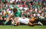 19 August 2023; Cian Prendergast of Ireland is tackled by Joe Marchant of England during the Bank of Ireland Nations Series match between Ireland and England at the Aviva Stadium in Dublin. Photo by Harry Murphy/Sportsfile