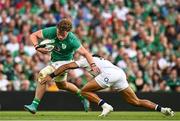 19 August 2023; Cian Prendergast of Ireland is tackled by Joe Marchant of England during the Bank of Ireland Nations Series match between Ireland and England at the Aviva Stadium in Dublin. Photo by Harry Murphy/Sportsfile
