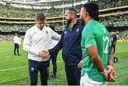 19 August 2023; Ireland head coach Andy Farrell shakes hands with Owen Farrell of England, in the company of Manu Tuilagi of England, right, after the Bank of Ireland Nations Series match between Ireland and England at Aviva Stadium in Dublin. Photo by Ramsey Cardy/Sportsfile
