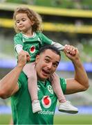 19 August 2023; James Lowe of Ireland with Iris, daughter of teammate Jamison Gibson-Park, after the Bank of Ireland Nations Series match between Ireland and England at Aviva Stadium in Dublin. Photo by Brendan Moran/Sportsfile