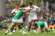 19 August 2023; Theo Dan of England is tackled by Conor Murray of Ireland during the Bank of Ireland Nations Series match between Ireland and England at Aviva Stadium in Dublin. Photo by Ramsey Cardy/Sportsfile