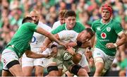 19 August 2023; Ben Earl of England is tackled by Ross Byrne, left, and Joe McCarthy of Ireland during the Bank of Ireland Nations Series match between Ireland and England at Aviva Stadium in Dublin. Photo by Ramsey Cardy/Sportsfile