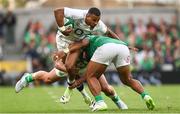 19 August 2023; Anthony Watson of England is tackled by James Lowe, left, and Bundee Aki of Ireland during the Bank of Ireland Nations Series match between Ireland and England at Aviva Stadium in Dublin. Photo by Ramsey Cardy/Sportsfile