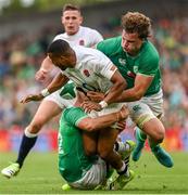 19 August 2023; Anthony Watson of England is tackled by Jack Crowley, left, and Cian Prendergast of Ireland during the Bank of Ireland Nations Series match between Ireland and England at Aviva Stadium in Dublin. Photo by Ramsey Cardy/Sportsfile