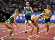 19 August 2023; Jack Raftery of Ireland prepares to pass the baton to teammate Sophie Becker before competing in the mixed 4x400m relay during day one of the World Athletics Championships at the National Athletics Centre in Budapest, Hungary. Photo by Sam Barnes/Sportsfile