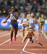 19 August 2023; Alexis Holmes of USA, left, on her way to winning the mixed 4x400m relay as Femke Bol of Netherlands falls during day one of the World Athletics Championships at the National Athletics Centre in Budapest, Hungary. Photo by Sam Barnes/Sportsfile