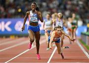 19 August 2023; Alexis Holmes of USA, left, on her way to winning the mixed 4x400m relay as Femke Bol of Netherlands falls during day one of the World Athletics Championships at the National Athletics Centre in Budapest, Hungary. Photo by Sam Barnes/Sportsfile