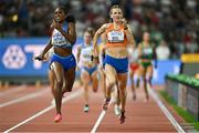 19 August 2023; Alexis Holmes of USA, left, and Femke Bol of Netherlands compete in the mixed 4x400m relay final during day one of the World Athletics Championships at the National Athletics Centre in Budapest, Hungary. Photo by Sam Barnes/Sportsfile