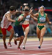 19 August 2023; Sophie Becker of Ireland passes the baton to Chris O’Donnell while competing in the mixed 4x400m relay final during day one of the World Athletics Championships at the National Athletics Centre in Budapest, Hungary. Photo by Sam Barnes/Sportsfile