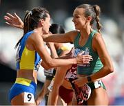 20 August 2023; Sharlene Mawdsley of Ireland, right, is congratulatred by Kateryna Karpiuk of Ukraine after running a PB in the women's 400m heat during day two of the World Athletics Championships at National Athletics Centre in Budapest, Hungary. Photo by Sam Barnes/Sportsfile