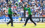 20 August 2023; Ireland bowler Ben White, right, is congratulated by teammate Lorcan Tucker after claiming the wicket of India's Sanju Samson during match two of the Men's T20 International series between Ireland and India at Malahide Cricket Ground in Dublin. Photo by Seb Daly/Sportsfile