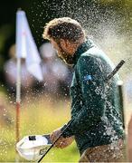 20 August 2023; Daniel Brown of England is sprayed with champagne after winning the mens event at the ISPS HANDA World Invitational presented by AVIV Clinics 2023 at Galgorm Castle Golf Club in Ballymena, Antrim. Photo by Ramsey Cardy/Sportsfile