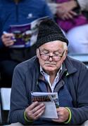 20 August 2023; Alphie Roche, from Killeen in Wexford, reads the matcch programme before the Wexford County Senior Hurling Championship final match between Naomh Éanna and Oylegate-Glenbrien at Chadwicks Wexford Park in Wexford. Photo by Piaras Ó Mídheach/Sportsfile