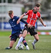 20 August 2023; Chris Forrester of St Patrick's Athletic in action against Cameron Dummigan of Derry City during the Sports Direct Men’s FAI Cup Second Round match between Derry City and St Patrick’s Athletic at The Ryan McBride Brandywell Stadium in Derry. Photo by Ben McShane/Sportsfile
