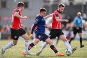 20 August 2023; Jason McClelland of St Patrick's Athletic in action against Cameron Dummigan, right, and Ciarán Coll of Derry City during the Sports Direct Men’s FAI Cup Second Round match between Derry City and St Patrick’s Athletic at The Ryan McBride Brandywell Stadium in Derry. Photo by Ben McShane/Sportsfile