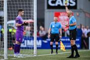 20 August 2023; Referee Neil Doyle issues a yellow card to Derry City goalkeeper Brian Maher during the penalty shootout during the Sports Direct Men’s FAI Cup Second Round match between Derry City and St Patrick’s Athletic at The Ryan McBride Brandywell Stadium in Derry. Photo by Ben McShane/Sportsfile