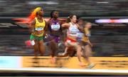 21 August 2023; Shelly-Ann Fraser-Pryce of Jamaica, left, competes in the women's 100m semi-final during day three of the World Athletics Championships at the National Athletics Centre in Budapest, Hungary. Photo by Sam Barnes/Sportsfile