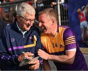 21 August 2023; Jim Bolger's Stars manager Liam Griffin and former Galway hurler Ollie Canning talks tactics at half-time during the Hurling for Cancer Research 2023 charity match at Netwatch Cullen Park in Carlow. Photo by Piaras Ó Mídheach/Sportsfile