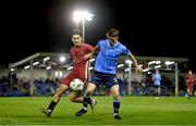 21 August 2023; Michael Gallagher of UCD in action against Ronan Manning of Galway United during the Sports Direct Men’s FAI Cup Second Round match between UCD and Galway United at the UCD Bowl in Dublin. Photo by Ben McShane/Sportsfile