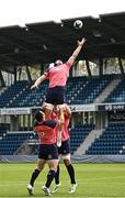 22 August 2023; Ryan Baird is lifted in a lineout by Cian Healy and Peter O’Mahony during an Ireland rugby squad training session at Parc des Sports Jean Dauger in Bayonne, France. Photo by Harry Murphy/Sportsfile