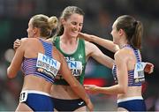 22 August 2023; Ciara Mageean of Ireland, centre, is embraced by Melissa Courtney-Bryant, left, and Laura Muir of Great Britain after competing in the women's 1500m final during day four of the World Athletics Championships at the National Athletics Centre in Budapest, Hungary. Photo by Sam Barnes/Sportsfile