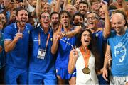 22 August 2023; Gianmarco Tamberi of Italy, centre, celebrates with his wife Chiara Bontempi, bottom and supporters and coaching staff after winning gold in the men's high jump final during day four of the World Athletics Championships at the National Athletics Centre in Budapest, Hungary. Photo by Sam Barnes/Sportsfile