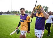 21 August 2023; Kilkenny hurler Eoin Murphy, left, and Limerick hurler Dan Morrissey of Jim Bolger's Stars in the parade before the Hurling for Cancer Research 2023 charity match at Netwatch Cullen Park in Carlow. Photo by Piaras Ó Mídheach/Sportsfile