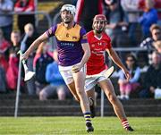 21 August 2023; Limerick hurler Kyle Hayes of Jim Bolger's Stars gets away from Clare hurler Peter Duggan of Davy Russell's Best during the Hurling for Cancer Research 2023 charity match at Netwatch Cullen Park in Carlow. Photo by Piaras Ó Mídheach/Sportsfile