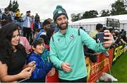 23 August 2023; Andrew Balbirnie of Ireland takes a selfie with spectators before match three of the Men's T20 International series between Ireland and India at Malahide Cricket Ground in Dublin. Photo by Seb Daly/Sportsfile