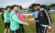 23 August 2023; Ireland captain Paul Stirling, left, and India captain Jasprit Bumrah shake hands after the abandonment of match three of the Men's T20 International series between Ireland and India at Malahide Cricket Ground in Dublin. Photo by Seb Daly/Sportsfile