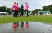 23 August 2023; Umpires, from left, Jareth McCready, Paul Reynolds, Aidan Seaver and Mark Hawthorne inspect the surface before the subsequential abandonment of match three of the Men's T20 International series between Ireland and India at Malahide Cricket Ground in Dublin. Photo by Seb Daly/Sportsfile
