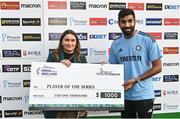 23 August 2023; India captain Jasprit Bumrah is presented with the Player of the Series award by Joy e-Bike firector Sheetal Bhalerao after the abandonment of match three of the Men's T20 International series between Ireland and India at Malahide Cricket Ground in Dublin. Photo by Seb Daly/Sportsfile